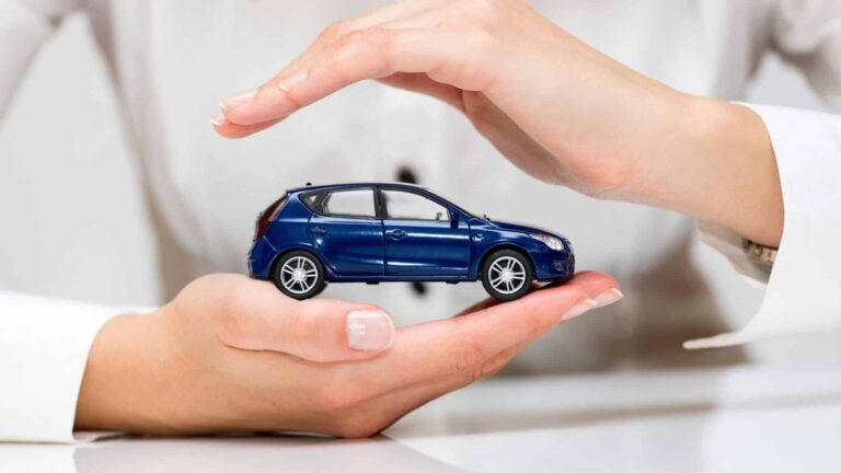 A man protecting a car with hands ensuring regular car inspections to prevent accidents