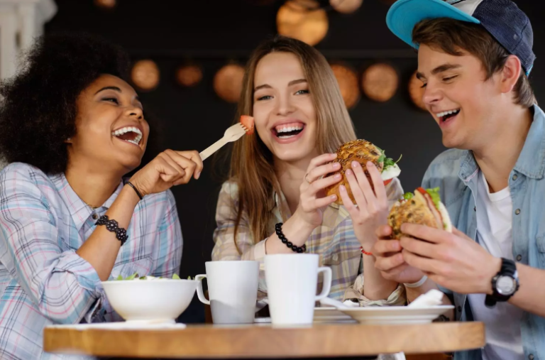 Friends trying different fast food restaurants